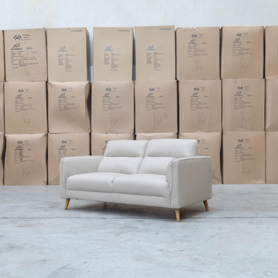 The Alyssa Two Seat Leather Sofa - White available to purchase from Warehouse Furniture Clearance at our next sale event.
