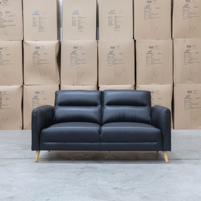 The Alyssa Two Seat Leather Sofa - Black available to purchase from Warehouse Furniture Clearance at our next sale event.