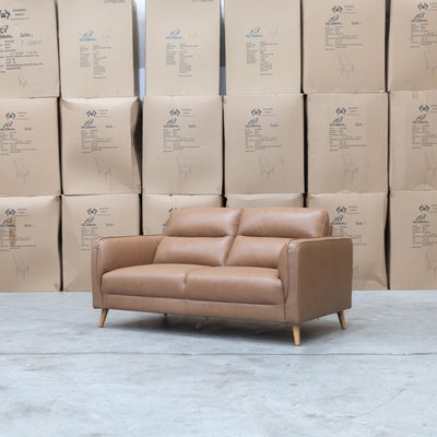 The Alyssa Two Seat Leather Sofa - Tan available to purchase from Warehouse Furniture Clearance at our next sale event.