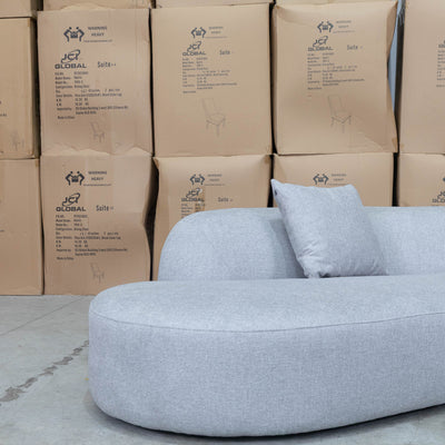 The Belview Curved Chaise Lounge - Light Grey available to purchase from Warehouse Furniture Clearance at our next sale event.