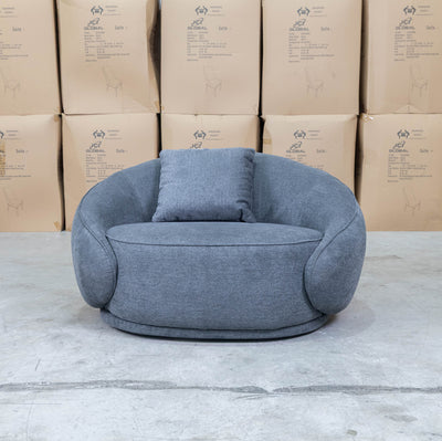The Noosa Curved Fabric Armchair - Dark Grey available to purchase from Warehouse Furniture Clearance at our next sale event.