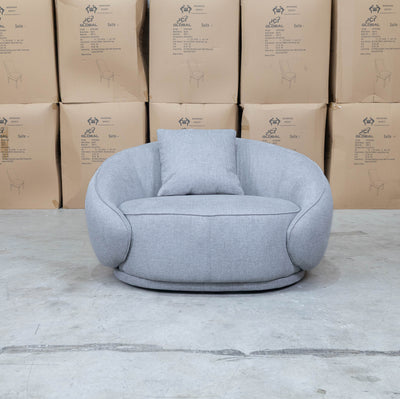 The Noosa Curved Fabric Armchair - Light Grey available to purchase from Warehouse Furniture Clearance at our next sale event.