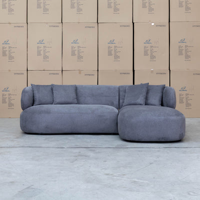 The Rhodes Curved Three Seat Chaise Lounge - Charcoal available to purchase from Warehouse Furniture Clearance at our next sale event.