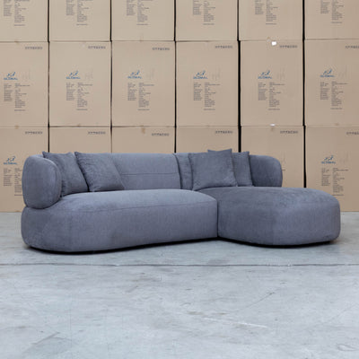 The Rhodes Curved Three Seat Chaise Lounge - Charcoal available to purchase from Warehouse Furniture Clearance at our next sale event.