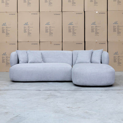 The Rhodes Curved Three Seat Chaise Lounge - Pewter available to purchase from Warehouse Furniture Clearance at our next sale event.