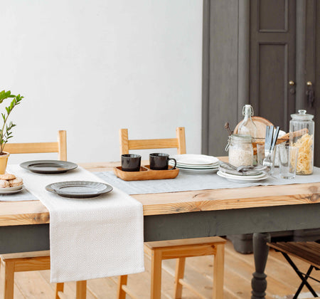 What are some factors to consider when purchasing a dining table?