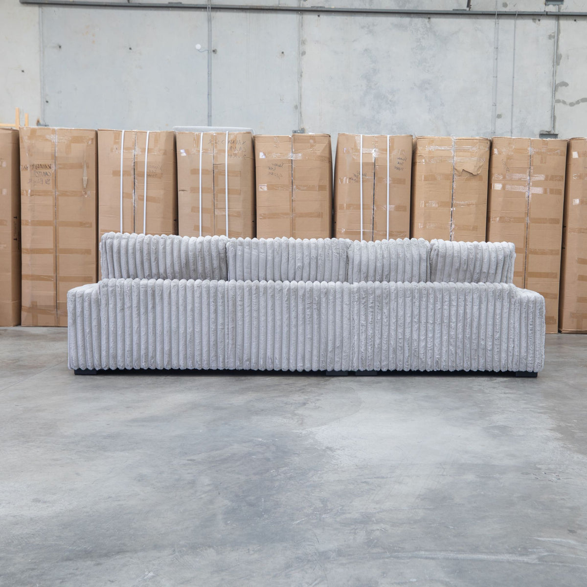 The Kalena Oversized Plush Feather & Foam LHF Chaise Lounge - Silver available to purchase from Warehouse Furniture Clearance at our next sale event.