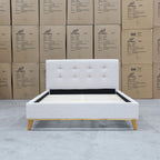 The Milos Double Upholstered Bed - Oat White available to purchase from Warehouse Furniture Clearance at our next sale event.