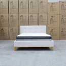 The Milos Double Upholstered Bed - Oat White available to purchase from Warehouse Furniture Clearance at our next sale event.