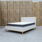 The Milos Double Upholstered Bed - Oat White available to purchase from Warehouse Furniture Clearance at our next sale event.