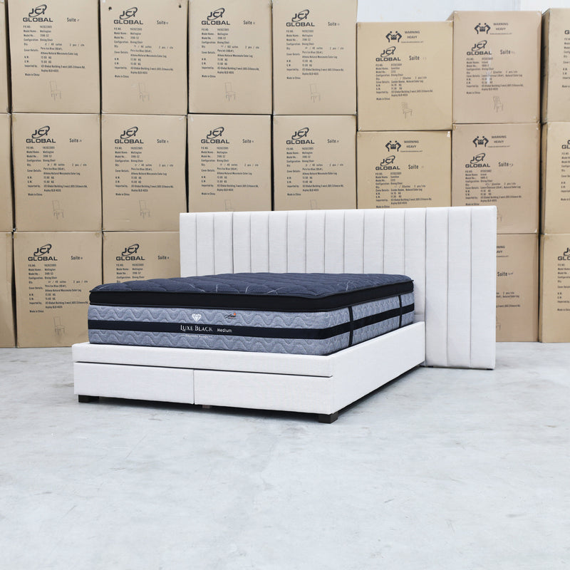 The Isla King Upholstered Storage Bed Extended Headboard - Oat White available to purchase from Warehouse Furniture Clearance at our next sale event.