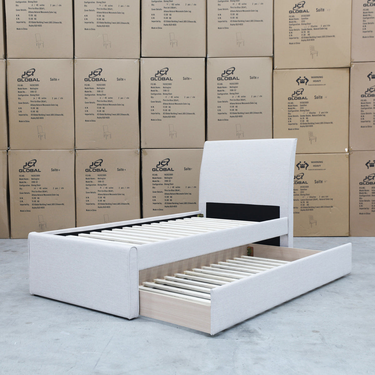 The York King Single Fabric Trundle Bed - Oat White (Reversible Trundle) available to purchase from Warehouse Furniture Clearance at our next sale event.