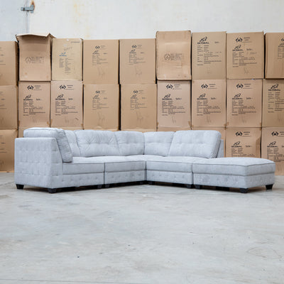 The Nobu Modular Corner Lounge with Ottoman - Share Slate available to purchase from Warehouse Furniture Clearance at our next sale event.