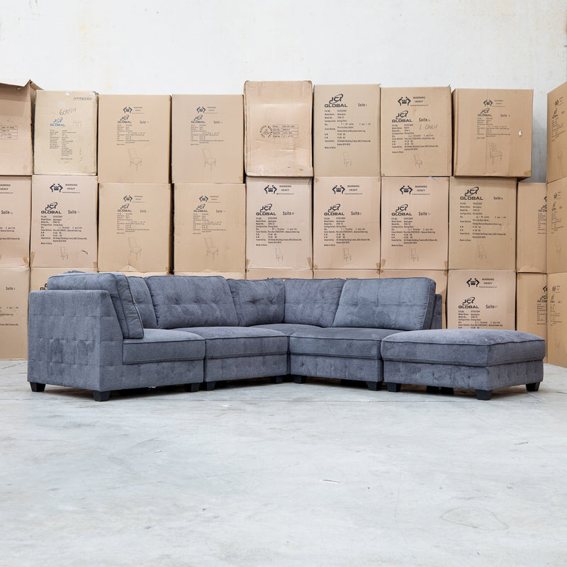 The Nobu Modular Corner Lounge with Ottoman - Share Charcoal available to purchase from Warehouse Furniture Clearance at our next sale event.