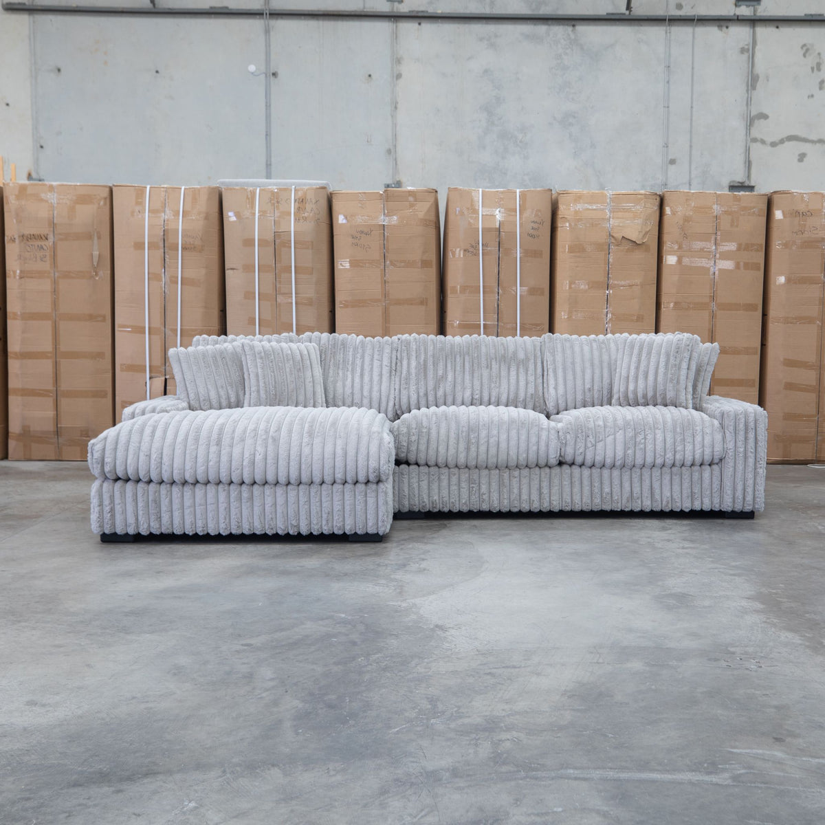 The Kalena Oversized Plush Feather & Foam LHF Chaise Lounge - Silver available to purchase from Warehouse Furniture Clearance at our next sale event.
