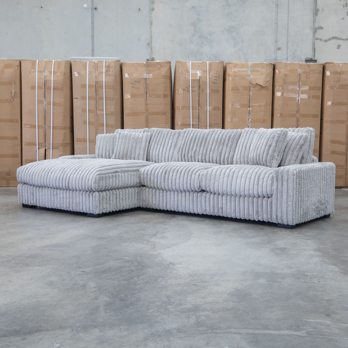The Kalena Oversized Plush Feather & Foam LHF Chaise Lounge - Silver available to purchase from Warehouse Furniture Clearance at our next sale event.