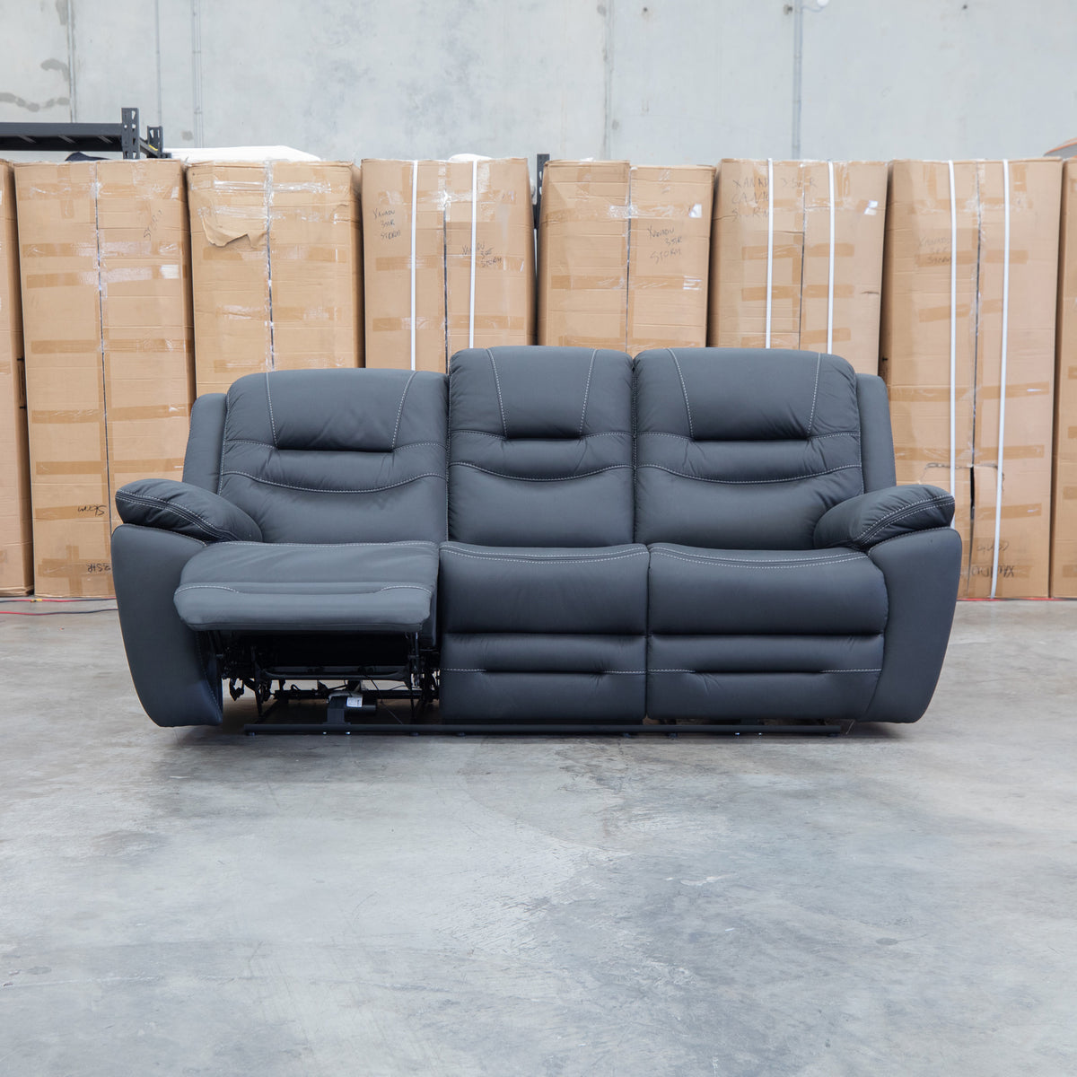 The Airlie Three Seat Electric Recliner Lounge - Jet available to purchase from Warehouse Furniture Clearance at our next sale event.