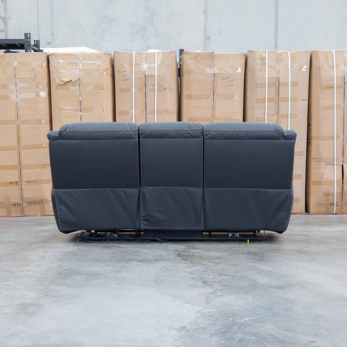 The Airlie Three Seat Electric Recliner Lounge - Jet available to purchase from Warehouse Furniture Clearance at our next sale event.