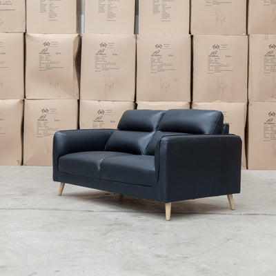 The Alyssa Two Seat Leather Sofa - Black available to purchase from Warehouse Furniture Clearance at our next sale event.
