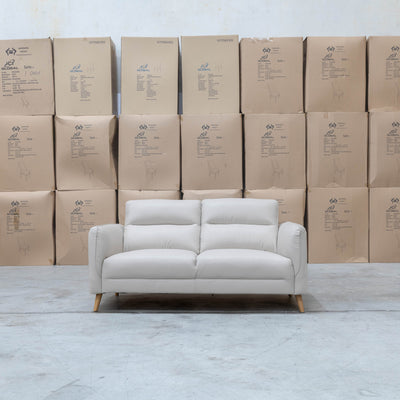 The Alyssa Two Seat Leather Sofa - White available to purchase from Warehouse Furniture Clearance at our next sale event.
