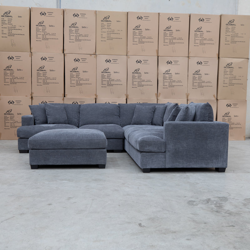 The Ashland Deep Seated Feather & Foam Corner Lounge with Ottoman - Licorice available to purchase from Warehouse Furniture Clearance at our next sale event.