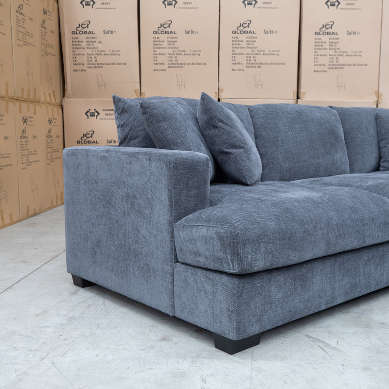 The Ashland Deep Seated Feather & Foam Corner Lounge with Ottoman - Licorice available to purchase from Warehouse Furniture Clearance at our next sale event.