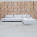 The Barles Modular Corner Lounge with Ottoman - Oat White available to purchase from Warehouse Furniture Clearance at our next sale event.