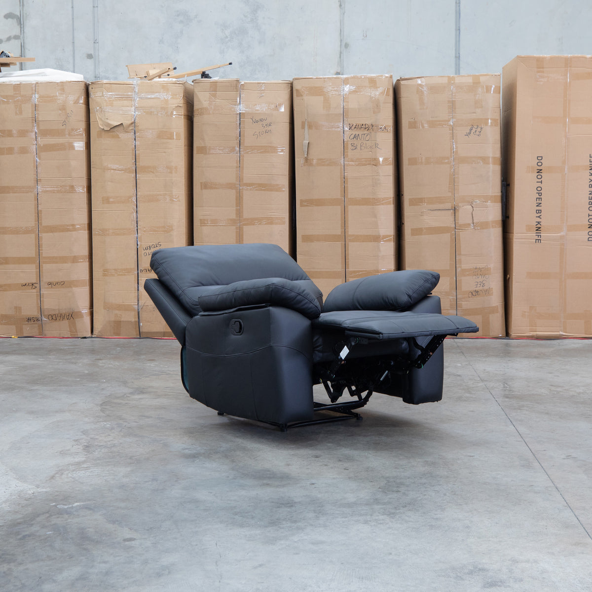 The Bayview Single Manual Leather Recliner - Black available to purchase from Warehouse Furniture Clearance at our next sale event.
