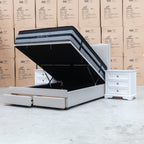 The Hayman Gas Lift & Drawer Storage Queen Bed - Oat White available to purchase from Warehouse Furniture Clearance at our next sale event.