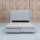 The Amie King Fabric Storage Bed - Oat White available to purchase from Warehouse Furniture Clearance at our next sale event.