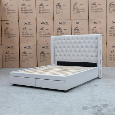 The Amie Queen Fabric Storage Bed – Oat White available to purchase from Warehouse Furniture Clearance at our next sale event.