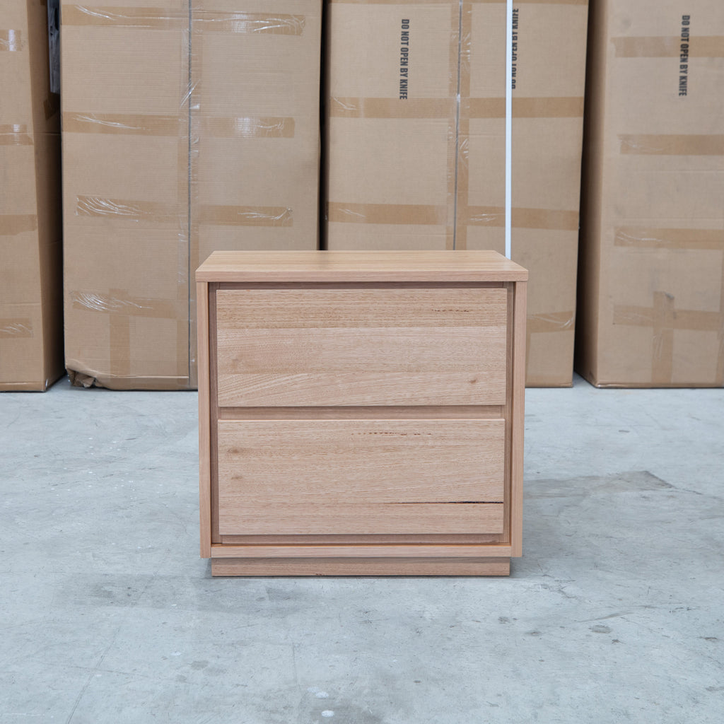 The Nova Two Drawer Australian Messmate Hardwood Bedside available to purchase from Warehouse Furniture Clearance at our next sale event.