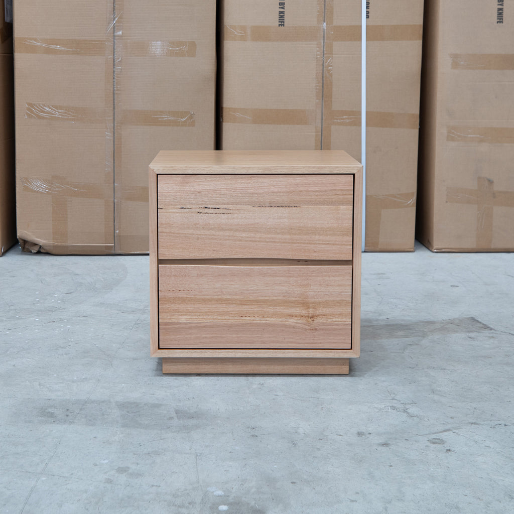The Lana Two Drawer Australian Messmate Hardwood Bedside available to purchase from Warehouse Furniture Clearance at our next sale event.