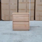 The Lana Two Drawer Australian Messmate Hardwood Bedside available to purchase from Warehouse Furniture Clearance at our next sale event.