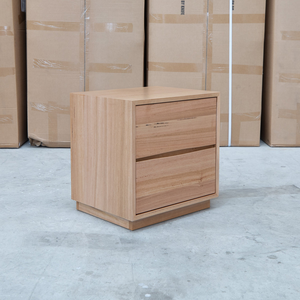 The Lana Two Drawer Australian Messmate Hardwood Bedside available to purchase from Warehouse Furniture Clearance at our next sale event.