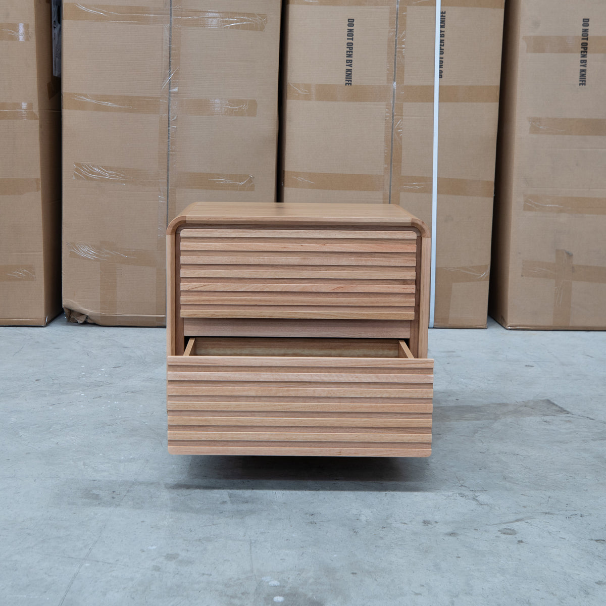 The Southport Two Drawer Australian Messmate Hardwood Bedside - Natural available to purchase from Warehouse Furniture Clearance at our next sale event.