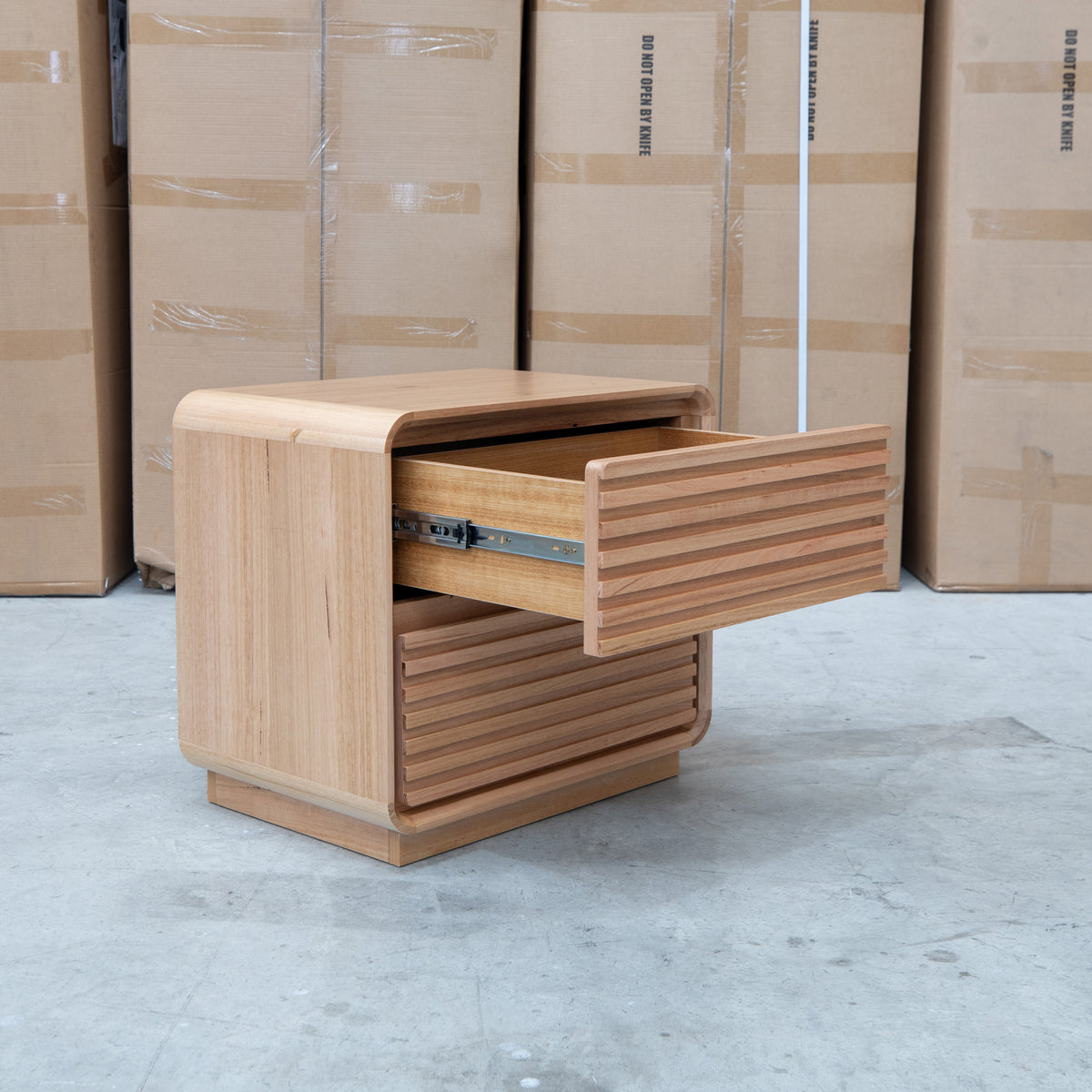 The Southport Two Drawer Australian Messmate Hardwood Bedside - Natural available to purchase from Warehouse Furniture Clearance at our next sale event.