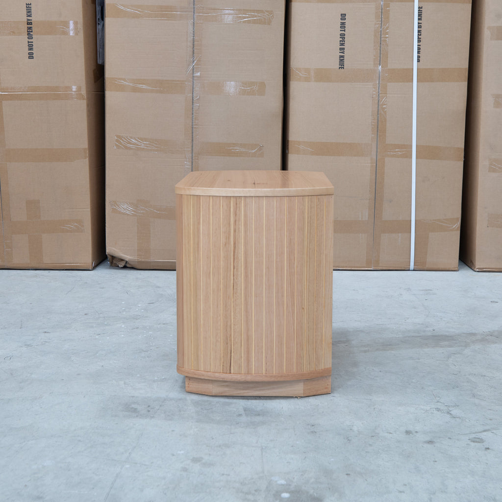 The Bentley Curved Two Drawer Australian Messmate Hardwood Bedside available to purchase from Warehouse Furniture Clearance at our next sale event.