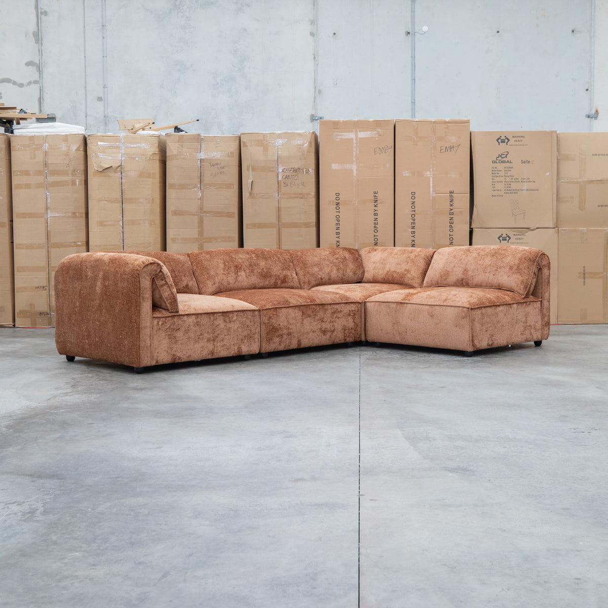 The Bellagio Deep Seat Modular Corner Lounge with Ottoman - Rust available to purchase from Warehouse Furniture Clearance at our next sale event.