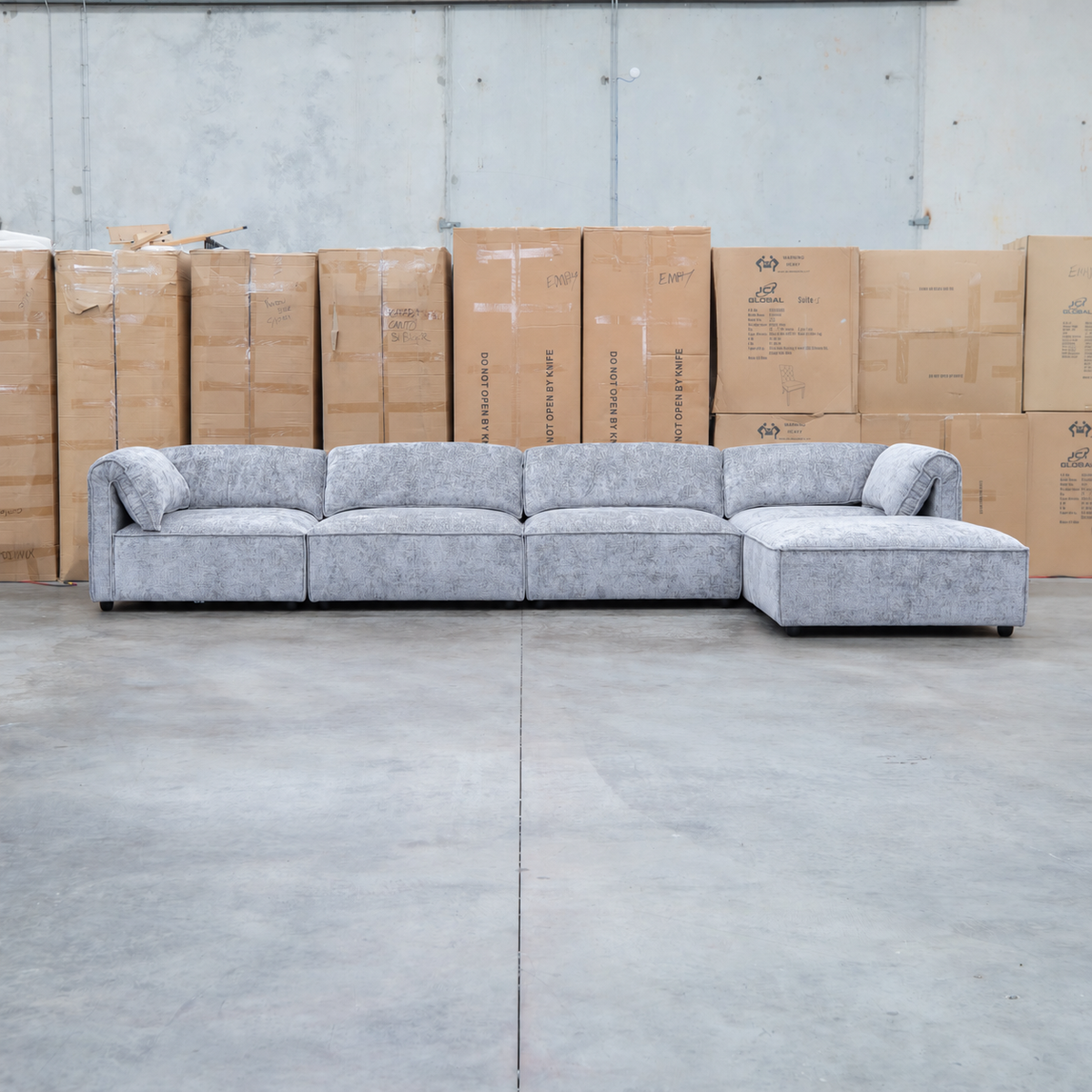 The Bellagio Deep Seat Modular Corner Lounge with Ottoman - Slate available to purchase from Warehouse Furniture Clearance at our next sale event.