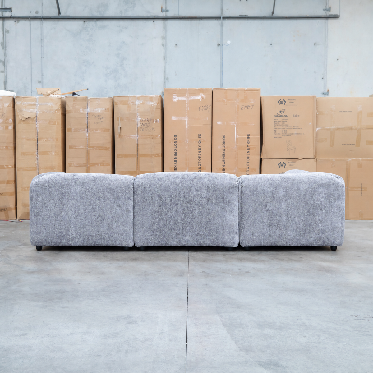 The Bellagio Deep Seat Modular Corner Lounge with Ottoman - Slate available to purchase from Warehouse Furniture Clearance at our next sale event.
