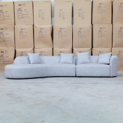 The Belview Curved Chaise Lounge - Light Grey available to purchase from Warehouse Furniture Clearance at our next sale event.