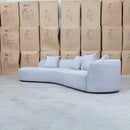 The Belview Curved Chaise Lounge - Light Grey available to purchase from Warehouse Furniture Clearance at our next sale event.