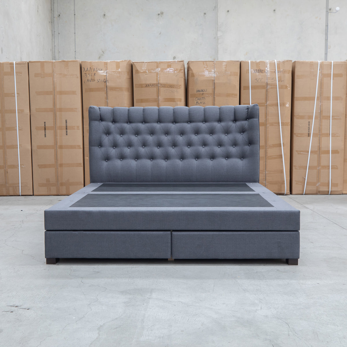 The Blake Queen Upholstered Gas Lift Storage Bed - Charcoal available to purchase from Warehouse Furniture Clearance at our next sale event.