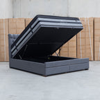 The Blake Queen Upholstered Gas Lift Storage Bed - Charcoal available to purchase from Warehouse Furniture Clearance at our next sale event.