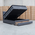 The Blake Queen Upholstered Gas Lift Storage Bed - Charcoal available to purchase from Warehouse Furniture Clearance at our next sale event.