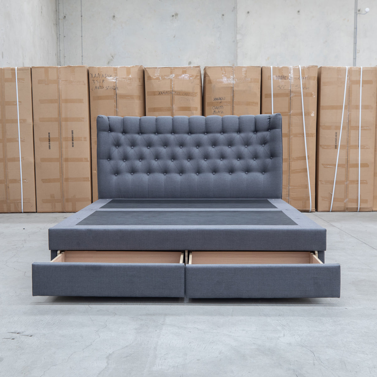 The Blake Queen Upholstered Gas Lift Storage Bed - Charcoal available to purchase from Warehouse Furniture Clearance at our next sale event.