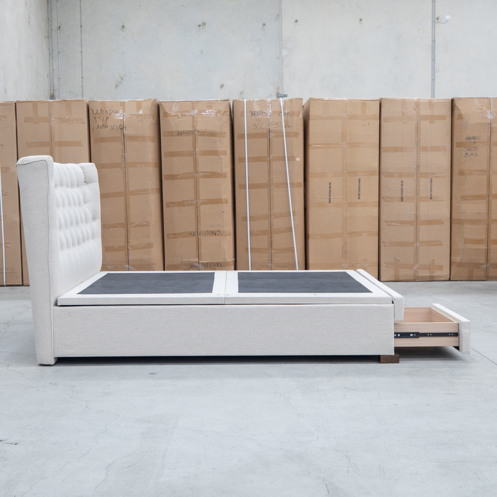 The Blake King Upholstered Gas Lift Storage Bed - Oat White available to purchase from Warehouse Furniture Clearance at our next sale event.