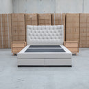 The Blake King Upholstered Gas Lift Storage Bed - Oat White available to purchase from Warehouse Furniture Clearance at our next sale event.