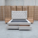 The Blake King Upholstered Gas Lift Storage Bed - Oat White available to purchase from Warehouse Furniture Clearance at our next sale event.